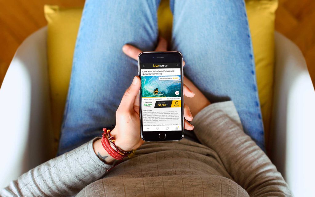 LiveSource app user bidding on auctions